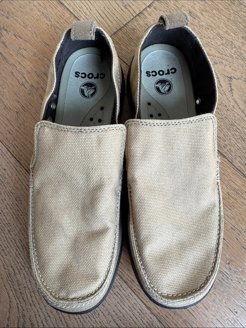 pair of khaki canvas Crocs Men's Walu Slip-On Loafers